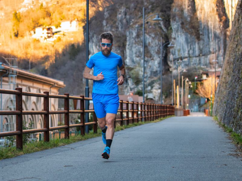 Training for the marathon on a cycle path. A male athlete